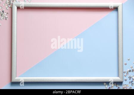 Frame with confetti and space for text on colorful background. Stock Photo