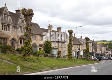 Houses on the High Street in Burford, Oxfordshire in the UK Stock Photo