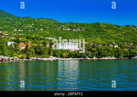 Beautiful Adriatic sea in Croatia, town of Lovran riviera, coastline villas in Kvarner bay Stock Photo