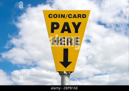coin / card, pay here sign in an outdoor car park Stock Photo