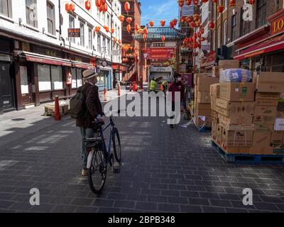 London. UK. May the 18th 2020 at noon. Wiew of Essential Workers in China Town. Stock Photo