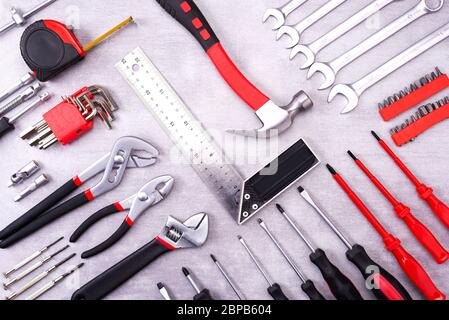 Coplet of repair tools on a gray background. Equipment for construction. Repair tool kit. View from above Stock Photo