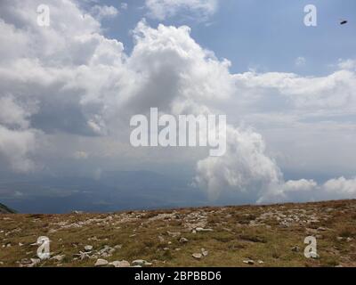 Dark clouds over the mountains Stock Photo