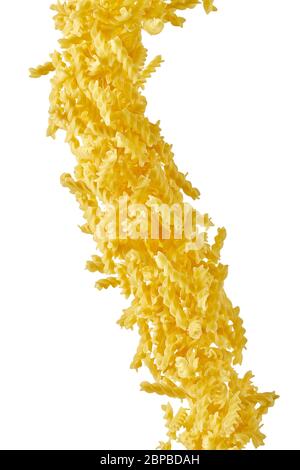 Italian flying raw pasta isolated on white background. macaroni fusilli falling. Stock Photo