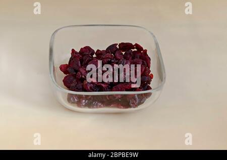 Portion of dried ripe Cranberry or Vaccinium oxycoccos fruit in a small bowl, Sofia, Bulgaria Stock Photo
