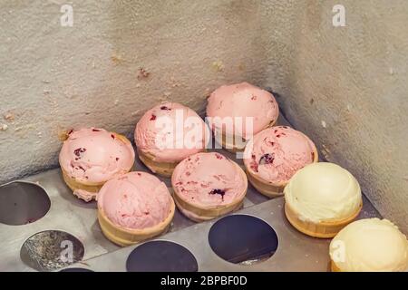 different sorts of ice cream in frige closeup Stock Photo