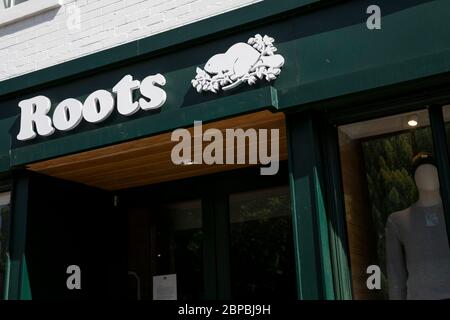Root From Store A logo sign outside of a Roots retail store location in Washington, D.C ...