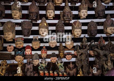 Carved wooden masks on sale in Mandalay, Myanmar Stock Photo