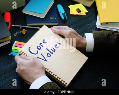 Handwritten sign core values about business on the sheet. Stock Photo