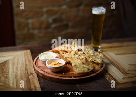 crispy fresh tortilla chips with sauces Stock Photo