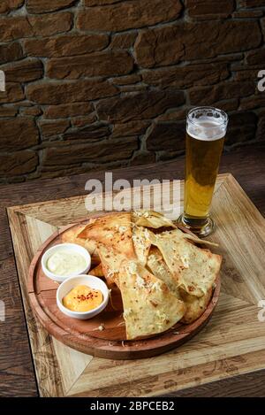 crispy fresh tortilla chips with sauces Stock Photo