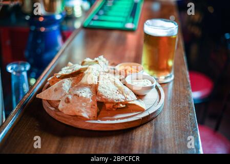 crispy fresh tortilla chips with sauces Stock Photo