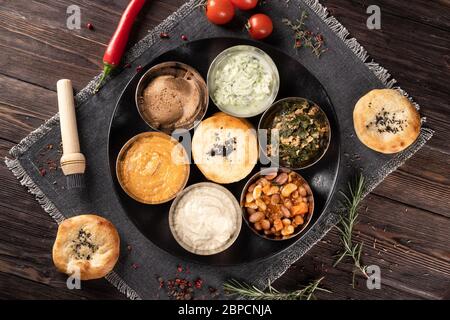 Assorted several Turkish snacks. Serving on a plate with tortillas. Stock Photo