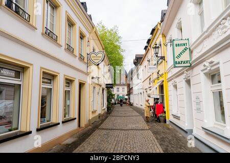 Moers, Germany - April 26, 2019: alley in the old town of Moers, with unidentified people. Moers is a district belonging city in the Lower Rhine Regio Stock Photo
