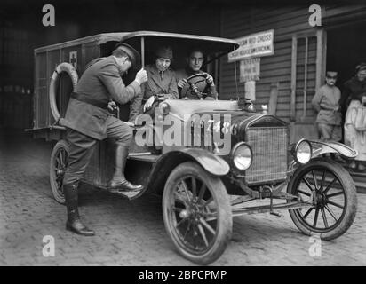 American Red Cross Doctor with her Assistants in American Red Cross Ambulance from Gare de l'Est, Paris, France, on Emergency Call to spot where Shell from Long-range Bombardment had just Fallen, Lewis Wickes Hine, American National Red Cross Photograph Collection, June 1918 Stock Photo