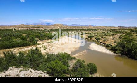 A view to the east with the Chisos Mountains in the distance from high on the Santa Elena Canyon Trail Stock Photo