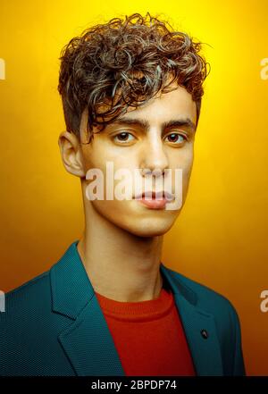 Young Handsome Man Portrait On Yellow Background Stock Photo