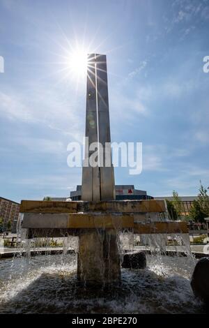 Hoyerswerda, Germany. 18th May, 2020. The Lausitzer Platz is the centre of the Saxon city of Hoyerswerda in the district of Bautzen. Here, life before it takes place at the fountain and in the adjacent Lausitzhalle or in the shopping mile of the Lausitz-Center. Credit: Daniel Schäfer/dpa-Zentralbild/Daniel Schäfer/dpa/Alamy Live News Stock Photo