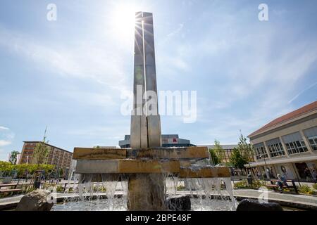 Hoyerswerda, Germany. 18th May, 2020. The Lausitzer Platz is the centre of the Saxon city of Hoyerswerda in the district of Bautzen. Here, life before it takes place at the fountain and in the adjacent Lausitzhalle or in the shopping mile of the Lausitz-Center. Credit: Daniel Schäfer/dpa-Zentralbild/Daniel Schäfer/dpa/Alamy Live News Stock Photo