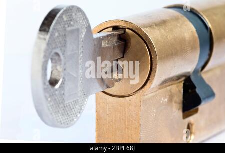 Detail of the key and plug - locked - cylinder lock - under lock and key - sense of security Stock Photo