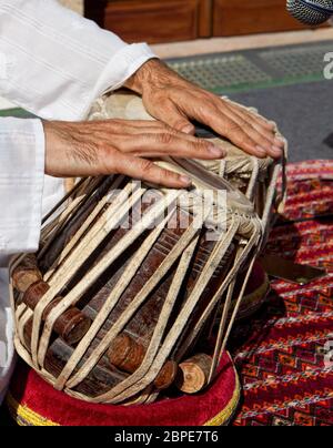 Man playing on traditional indian tabla drums. Closeup view Stock Photo