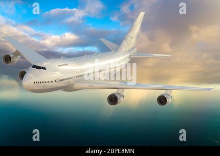 passenger plane during flight over the ocean Stock Photo
