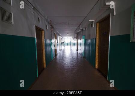 A long dark corridor with light at the end Stock Photo