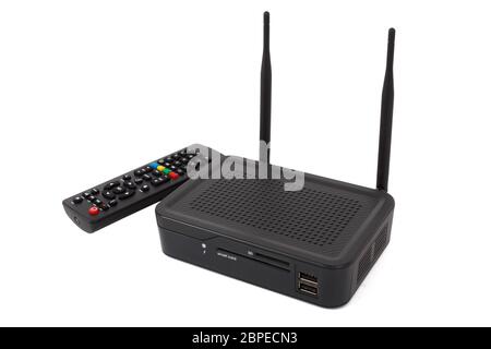 Android TV set top box receiver with remote controler and Wi-Fi  isolated on white Stock Photo