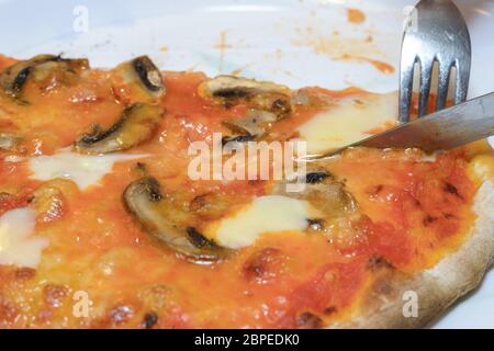 Tipical Italian Pizza with mushrooms cooked in a wood steam Stock Photo