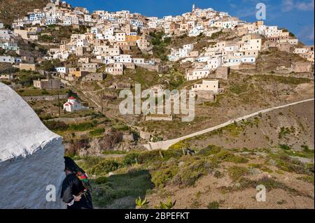 the village of Olympos with its traditional and colorful houses and its ruined windmill on the North of the karpathos, Greece Stock Photo