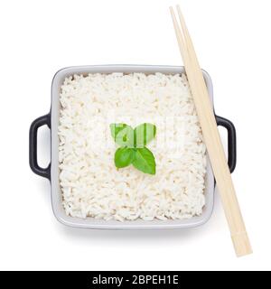 Rice with basil in ceramic bowl with wooden chopsticks, isolated on the white background, clipping path included. Stock Photo