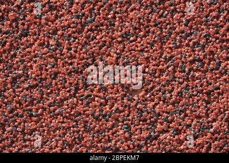 close view of the wall surface, decorative finishing, heat insulation granules or granite particles Stock Photo