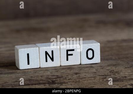 Info, written in cubes on a wooden background Stock Photo
