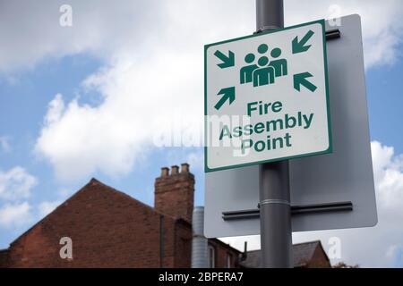 Information sign showing fire assembly point on the street. Stock Photo