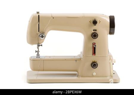 Old vintage beige sewing machine isolated on white background Stock ...