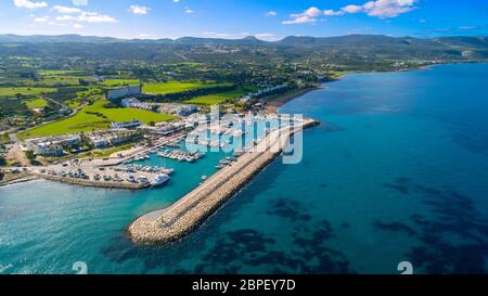 Aerial bird's eye view of Latchi port, Akamas peninsula, Polis Chrysochous, Paphos, Cyprus. The Latsi harbour with boats and yachts, fish restaurants, Stock Photo