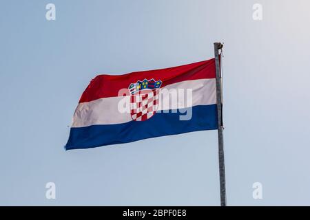 Croatian Flag on Blue Sky Background Bright Sunny Day Closeup Detail Stock Photo