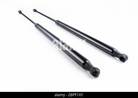 Two new gas springs, shock absorbers, isolated on white background with a clipping path. Stock Photo