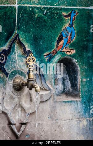 Historical fountain covered handmade Turkish Ottoman tiles in Iznik Stock Photo