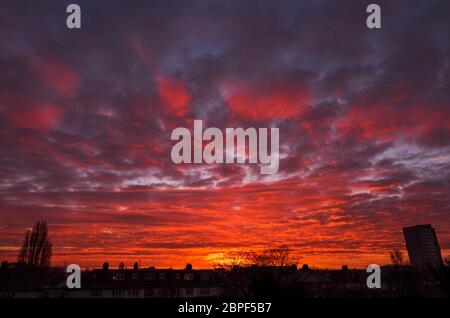 Beautiful winter morning sunrise on clouds over suburban London houses, UK Stock Photo