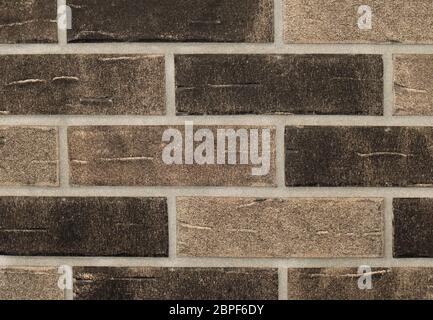 Grainy texture brown bricks wall pattern background Stock Photo