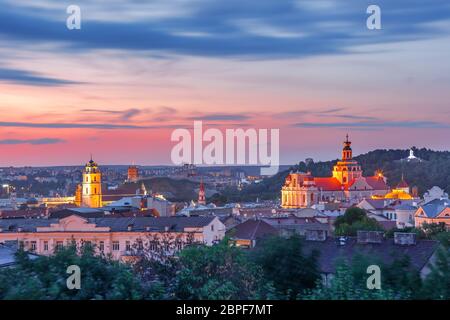 Aerial view over Old town with Gediminas Castle Tower, churches and Three Crosses on the Bleak Hill at sunrise, Vilnius, Lithuania, Baltic states. Stock Photo