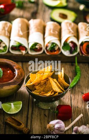 Tortilla wraps with vegetables. Mexican tortillas. Tacos with nachos and vegetables Stock Photo