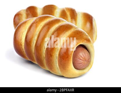 The sausage in the ruddy yeast bun with a golden crust isolated on white background. Stock Photo