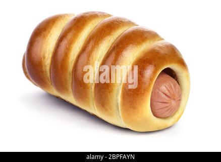 The sausage in the ruddy yeast bun with a golden crust isolated on white background. Stock Photo