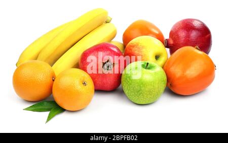 The set of several different fruits such as bananas, apples, pomegranates, oranges, persimmons isolated on white background. Stock Photo