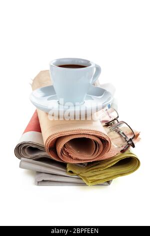 Coffee and newspapers isolated on white background. Stock Photo