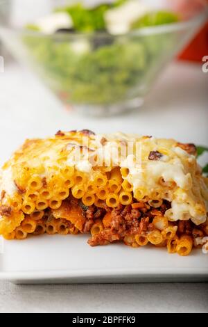 greek pastitsio with salad on a plate Stock Photo