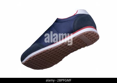 Sport shoes. Blue sneaker made of fabric with red accents. Stock Photo