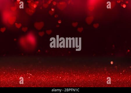 Red hearts on glittering background for valentins day Stock Photo